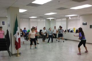 Group of people exercising together indoors