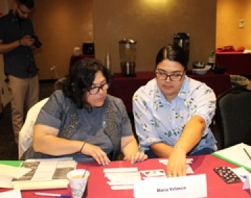 Photo of people sitting at table during event